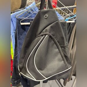 Black/Black. Cobalt Sling Backpack. New. Never used.